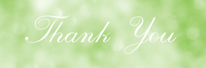 Thank You, lettering on green blurred background of lights