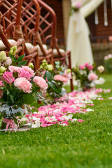 wedding bouquet and rose petals outdoors