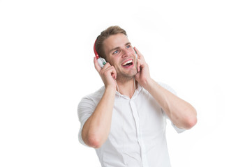 Favorite radio station. Man listening favorite song in headphones with smartphone and singing. Man enjoy listening music radio station isolated white background. Guy earphones listen radio station
