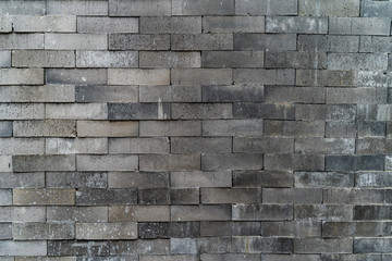 The concrete brick texture with cracks, scratches, smudges. The real rough blocks wall grungy background.