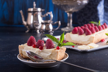Tarte shortcake with mascarpone, white chocolate and cream served with fresh raspberries and red currant.