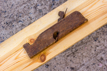 A hand plane is a tool for shaping wood using muscle power to force the cutting blade over the wood surface.
