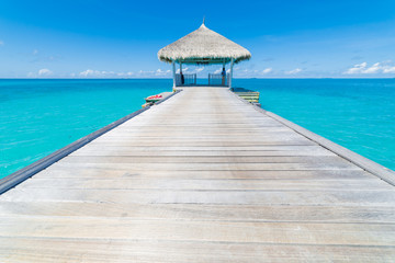 Water villas on the perfect tropical island. Beautiful blue water blue sky with inspirational mood, Maldives islands
