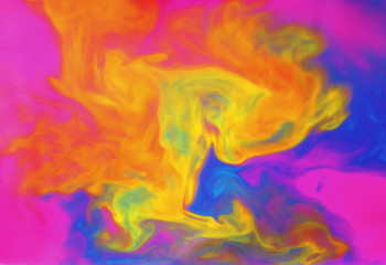 Fototapeta na wymiar Colored liquids mixed together in fluid creating colorful abstract background