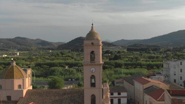 Vertigo effect of a bell tower in Sardinia, Tortol&igrave;. This footage was shoot at sunset, with a drone, 4K 30 fps
