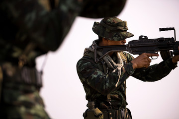 Cloesup squad of soldiers patrolling across the deep forest area.