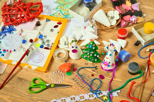 Handmade decorations for new year and other holidays. Artwork workplace with creative accessories.