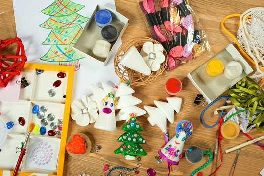 Handmade decorations for new year and other holidays. Artwork workplace with creative accessories.