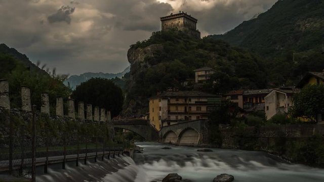 castle aosta long the river during the cloudy day time lapse