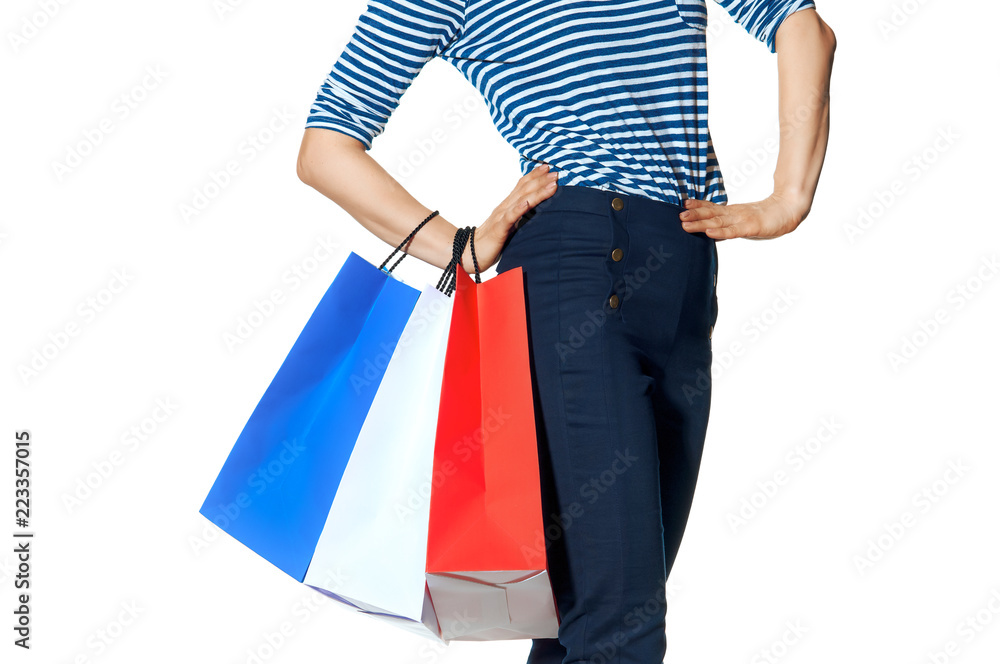 Wall mural modern woman with shopping bags on white background