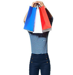 young fashion-monger holding shopping bags on white