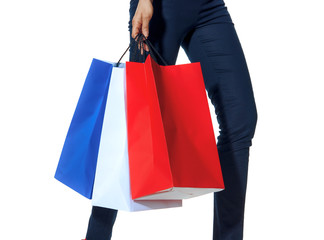 Closeup on fashion-monger walking with shopping bags on white