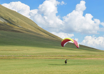Paragliding in the middle of volcanoes mountains