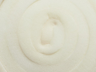 Fototapeta na wymiar Roll white foam rubber texture. Polystyrene sealing foam surface background. Insulation material close-up