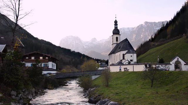Autumn view of St. Sebastian parish church against Reiter Alpe in Berchtesgaden Alps, Bavaria, Germany
