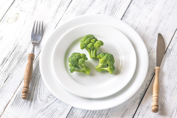 Fresh broccoli on the white plate