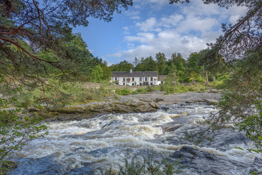 The river Dochart in spate as it crashes over the Falls of Dochart in Killin, Pertshire, Scotland.