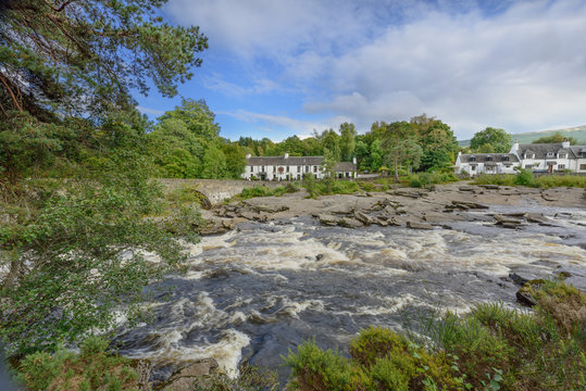 The river Dochart in spate as it crashes over the Falls of Dochart in Killin, Pertshire, Scotland.