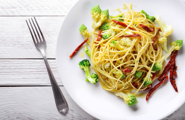Pasta. Spaghetti with broccoli, cauliflower and dried tomatoes