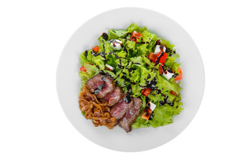Salad with roast beef with marinated onions and balsamic vinegar, sauce on plate, white isolated background, view from above, for the menu, restaurant, bar, cafe