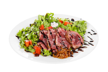 Salad with roast beef with marinated onions and balsamic vinegar, sauce on plate, white isolated background Side view. For the menu, restaurant, bar, cafe