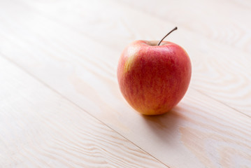 red apple on a wooden background