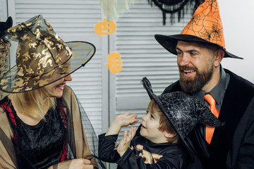 Holiday halloween with funny carnival costumes on halloween background. Happy family party. Horror...