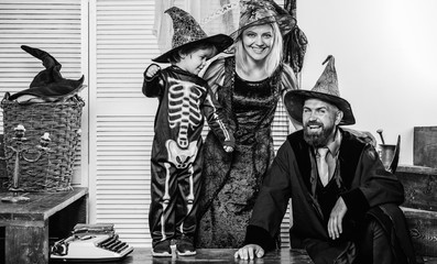 Halloween party. Halloween family holiday concept. Horror background. Holiday halloween with funny carnival costumes. Witch hat. Children play with pumpkins and treat. Trick or treat. Witch hat