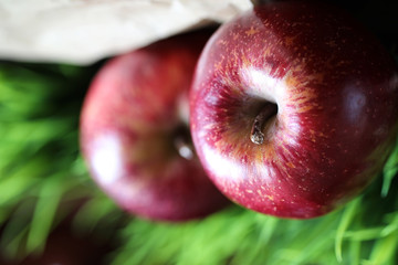 Red fresh apple on a wooden table