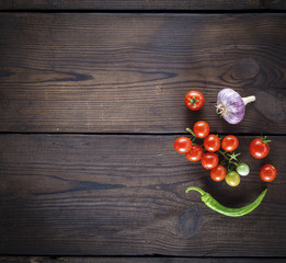 fresh ripe red cherry tomatoes, garlic and green chile peppers