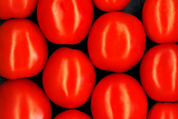 tomatoes tiled background / black textured background bright vegetables