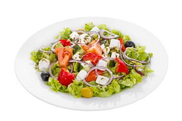 Greek salad with feta, olives, lettuce, red onion, cucumber, tomato, bell pepper, oil on plate, white isolated background Side view. For the menu, restaurant bar cafe
