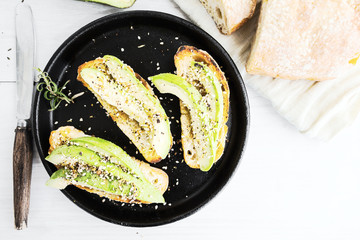 Sandwich with avocado and ciabatta. Top view.