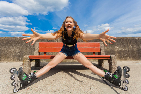 Joyful girl wearing roller skates