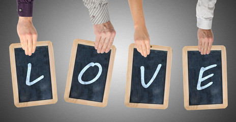 Letters of the word love written on chalkboards