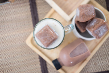 Frozen chocolate in a glass with milk