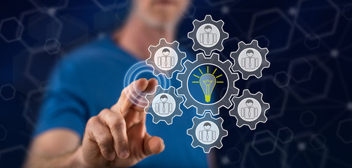 Man touching a teamwork idea concept