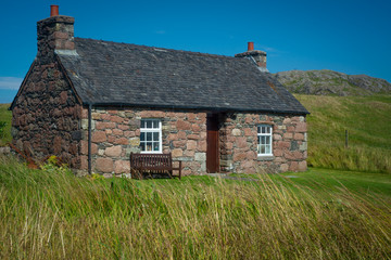 Red Stone Cottage with Slate Roof, Isle of Iona, Inner Hebrides, Scotland © ystewarthenderson