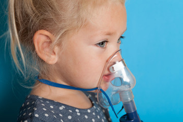 Oxygen therapy mask, hypoxia asthma. Kid girl.