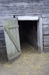 Old historic wooden open barn door  
