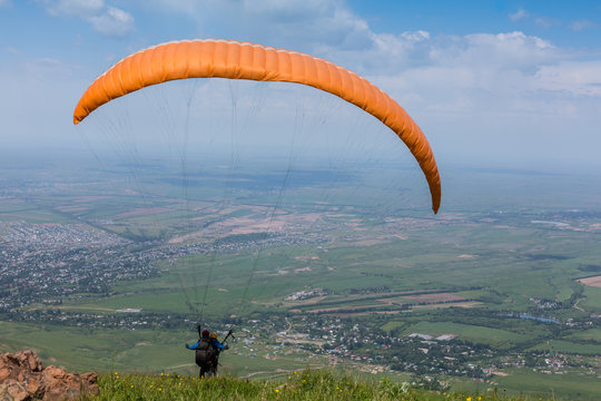 Paraglider is on the paraplane strops - soaring flight moment
