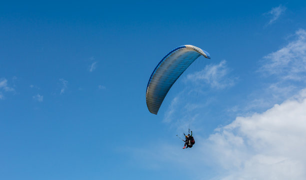 Paraglider is on the paraplane strops - soaring flight moment