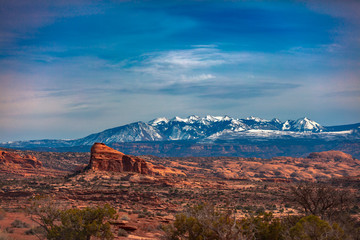 Naklejka premium Snow Capped Peaks And Cloudy Skies In Moab Utah