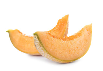 Slices of tasty ripe melon on white background