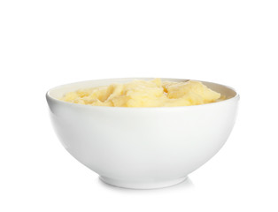 Bowl with tasty mashed potatoes on white background