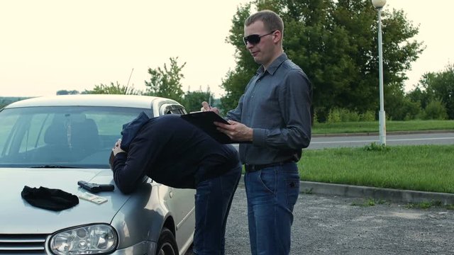 police investigator records evidence from the place of detention of the robber
