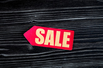 concept of sale on dark wooden background top view