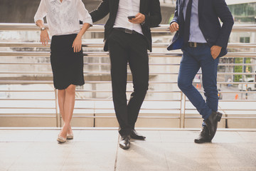 Cropped image of business talking and consult while standing together outdoor