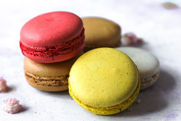 Colorful french macaroons on the blue table