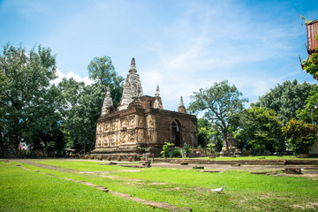 Fototapeta na wymiar The Maha chedi of Wat Chet Yot, Buddhist temple in Chiang Mai in northern Thailand